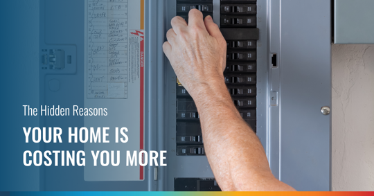 A hand adjusts a circuit breaker in an electrical panel. The image is overlaid with text that reads: "The Hidden Reasons YOUR HOME IS COSTING YOU MORE."